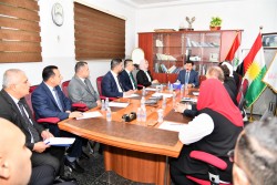 The Governor of the Central Bank of Iraq presides over a meeting with bank departments in Erbil